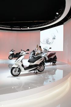 Visiting scooters and motorcycels stands during EICMA 2011, International Motorcycle Exhibition in Milan, Italy