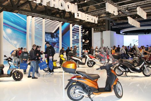 Visiting scooters and motorcycels stands during EICMA 2011, International Motorcycle Exhibition in Milan, Italy