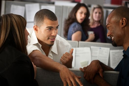 Office worker gossips about other lady in his cubicle