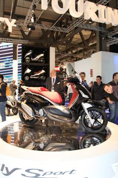 Visiting scooters and motorcycels stands during EICMA 2011, International Motorcycle Exhibition in Milan, Italy