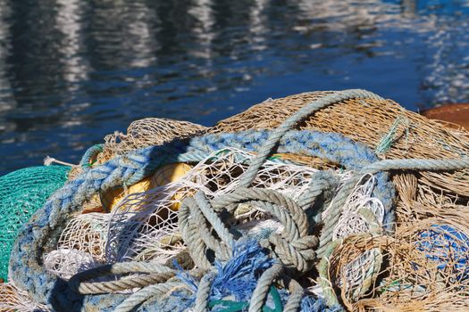 ropes and fishing net on the dock at the sun