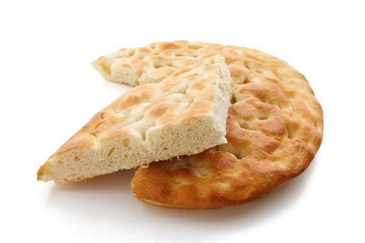 Typical salty italian bread called focaccia over white background