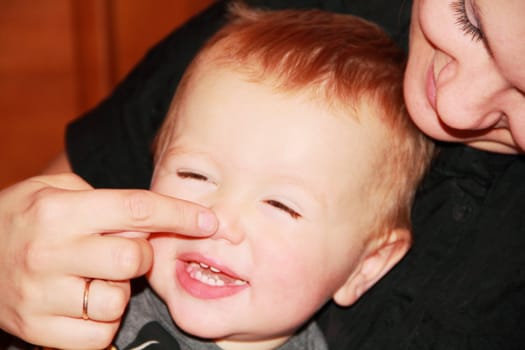 Cute baby 1 year with his mother