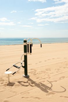 Fitmess machine outdoors on a sunny Mediterranean beach