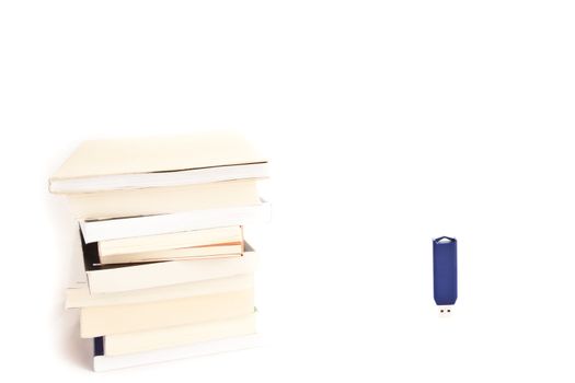 Concept of memories: blue usb key close to books