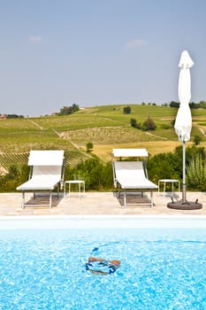 Swimming pool of an Italian beauty farm in the middle vineyards, Monferrato area, Piemonte region.