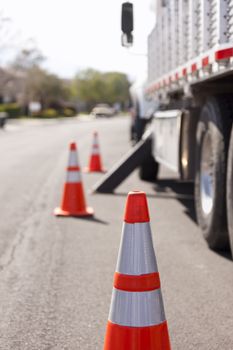 Orange Hazard Safety Cones and Work Truck on the Street.