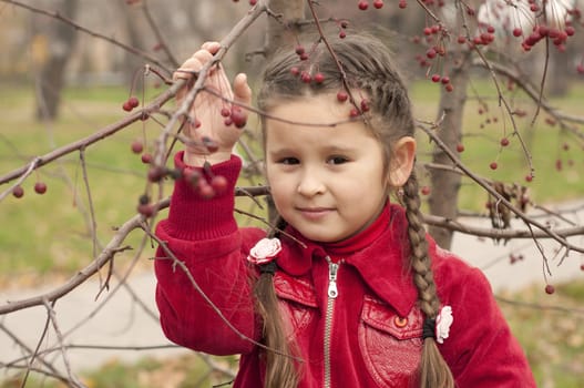 portrait of a young brunette girl in autumn park