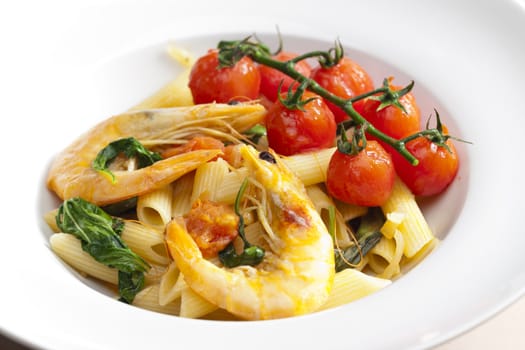 pasta penne with prawns, spinach and grilled cherry tomatoes
