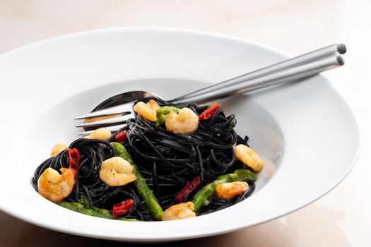 sepia spaghetti with prawns, asparagus and chilli