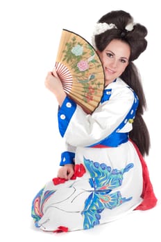 Portrait of the girl of the Asian appearance with a make-up under the geisha on a white background