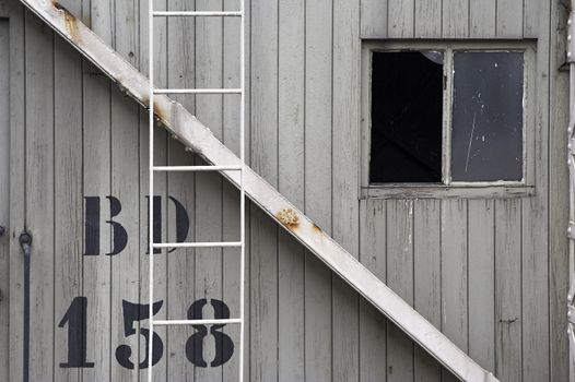 Close view of a side wall of an old port crane cabin