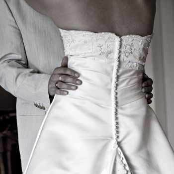 Bodyshot of a bride and groom dancing