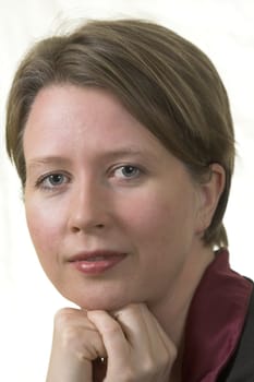 portrait of an attractive blonde woman looking in the camera.