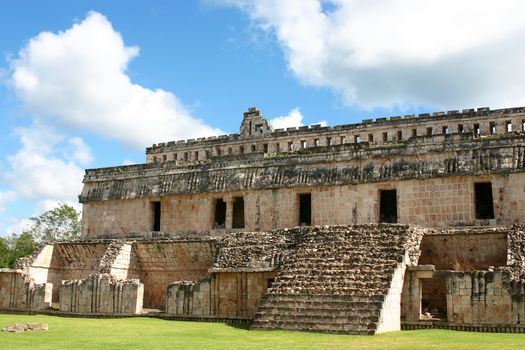 Maya ruins with antique columns over blue sky