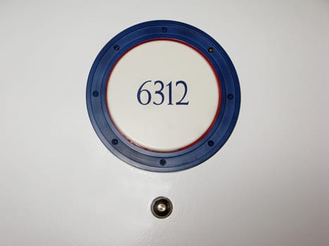A hotel room number on a door.