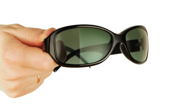 antisun glasses on a womanish hand in form person