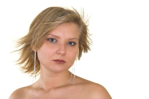 Head and shoulders portrait of a pretty young woman looking at you; naked shoulders; wind blown hair; isolated on white.