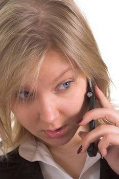 Head portrait of an attractive business woman talking on a cellular phone (GSM) 