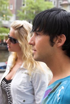 profile portrait of a young adult couple outdoors