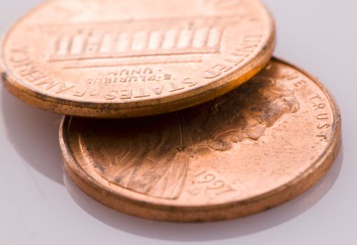 Two old pennies in a close up macro image.