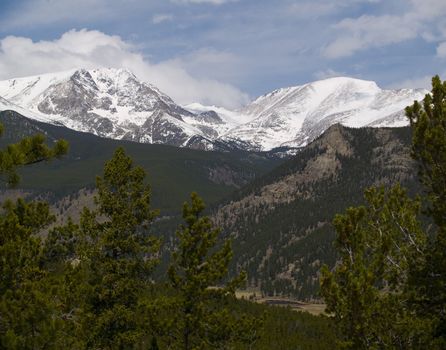 Two peaks over a distant valley in Rocky Mountain National Park