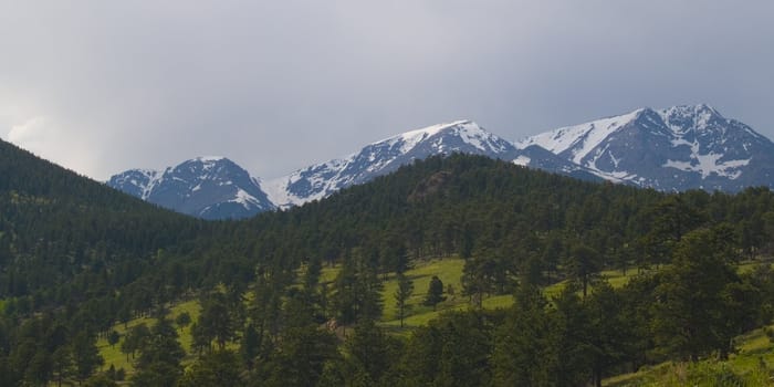 Three mountains in a spring rain storm in Rocky Mountain National Park