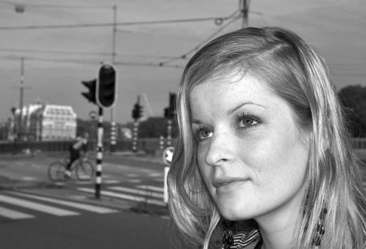 black and white portrait of a girl on city street