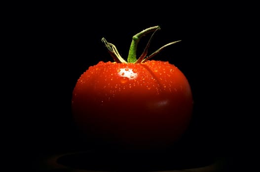 tomato on black background