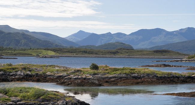 Panoramic view at small islands and mountains; Norway, Averoy, Atlantic road.