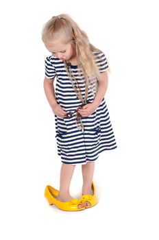 Shot of little cute with mother shoes in studio