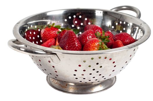 Shot of strawberries in strainer isolated on white