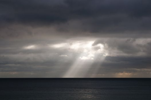 Sunbeam on the sea, stormy weather