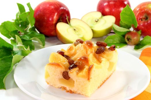 a piece of apple pie on a white plate