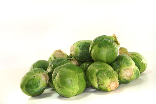 many florets green Brussels sprouts on white background