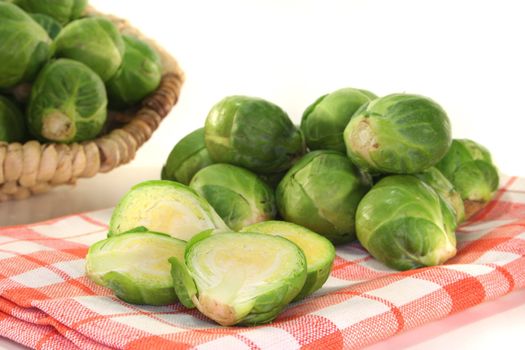 cut florets green Brussels sprouts on a checkered napkin