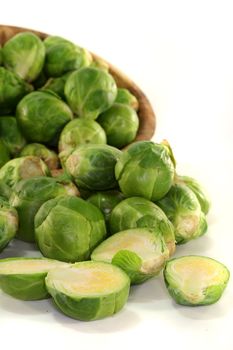 cut florets green Brussels sprouts on a white background