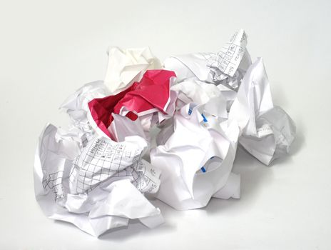 Heap of crumpled paper on white background