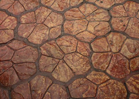 Brown floor tiles useful as a background