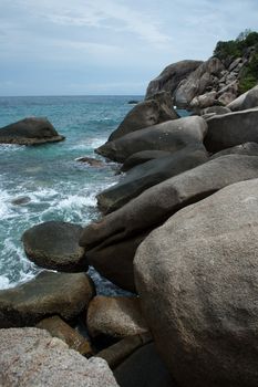 Sea coast with stones in water