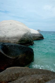 Sea coast with stones in water