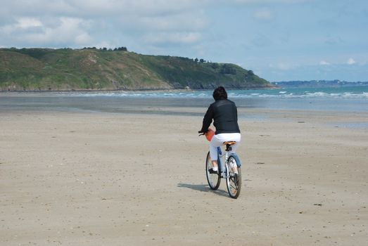 Bike rider on beach