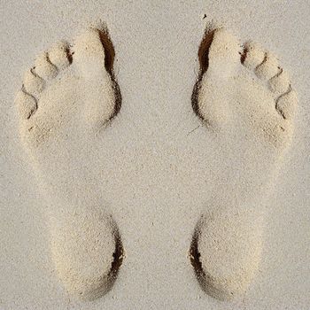 Footprints in sand on beach