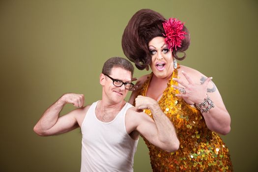 Short muscular man with impressed large drag queen