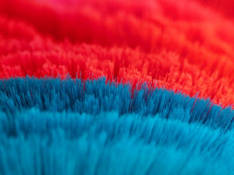 Macro of red and blue cleaning brushes