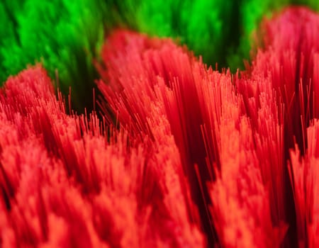Macro of red and green cleaning brushes