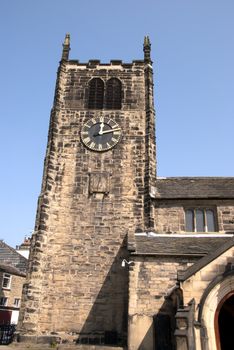 An old Church Tower under a blue spring sky