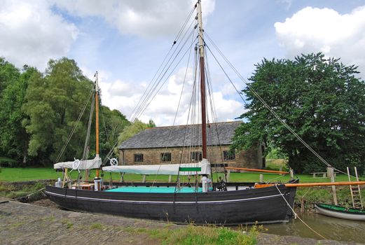 An Old Sailing Barge on a river in Devon