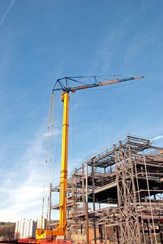 Yellow Tower Crane and Steelframed Building