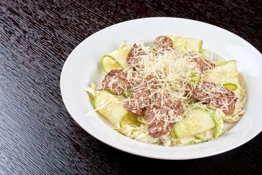 Salad with beef, lettuce, cucumber, string beans, Chinese cabbage and sauce